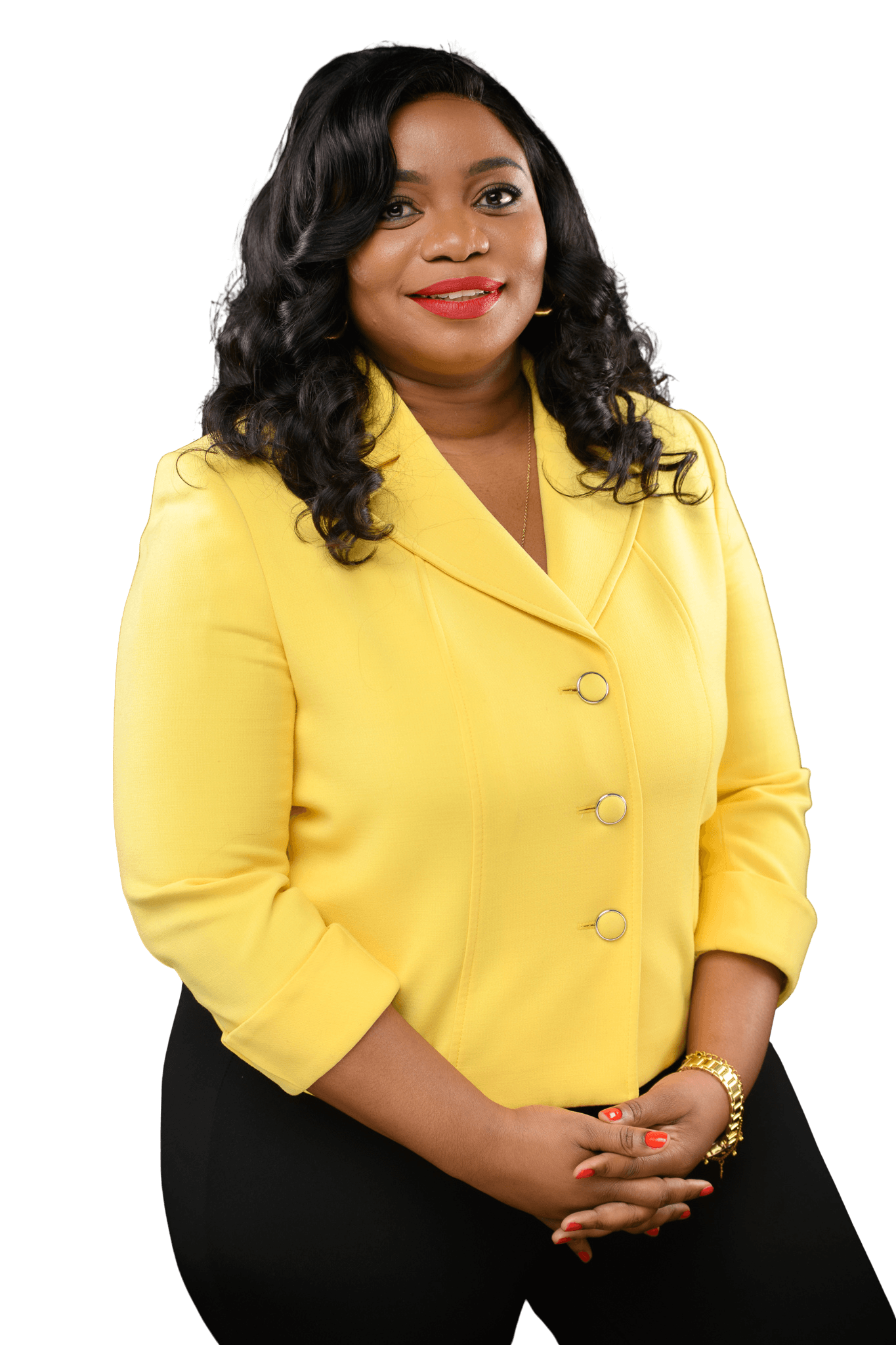 Imelda Kandiero Sabuni in a yellow blazer, hands clasped